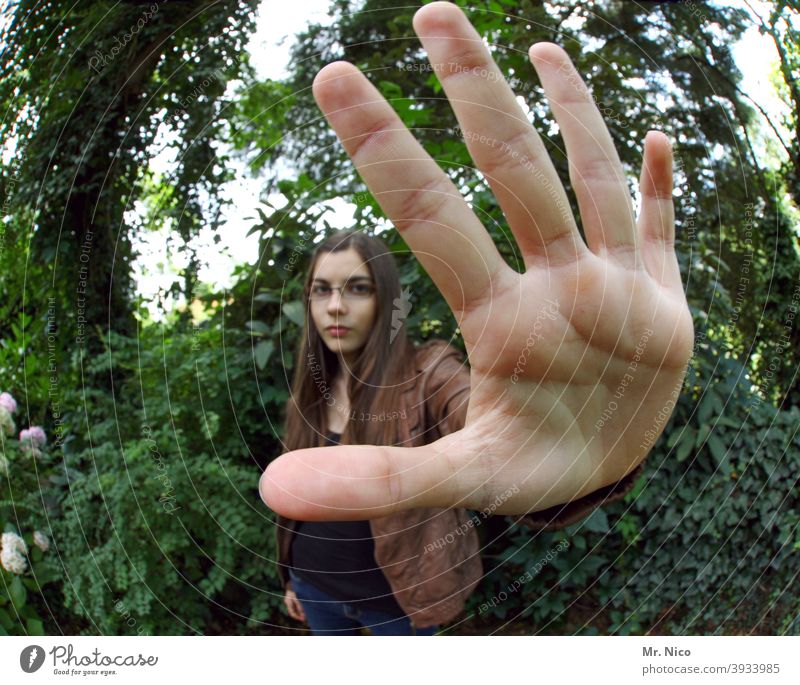 Stop , not one step closer Hand Fingers Woman Skin hand surface Feminine portrait Long-haired Nature Plant Green Youth (Young adults) Hold Palm of the hand