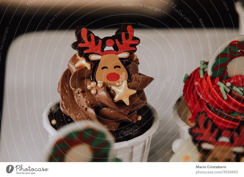 Close up of a cute cupcake in with reindeer decoration to show Christmas theme christmas cupcake christmas theme holiday baking reindeer design food art foodie