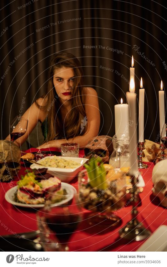 It is supposed to be the most “wonderful time of the year!” Stressed out about gaining weight during the holidays? Try putting some skulls on the table like this gorgeous brunette girl and maybe have a glass or more wine rather than a spoon of salad.