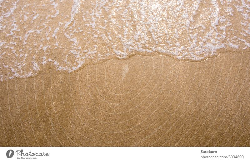 White bubble of Sea wave on the beach sand fine sea ocean ebb sun nature blue tide splash movement clear tropical relax foam beautiful relaxation summer water