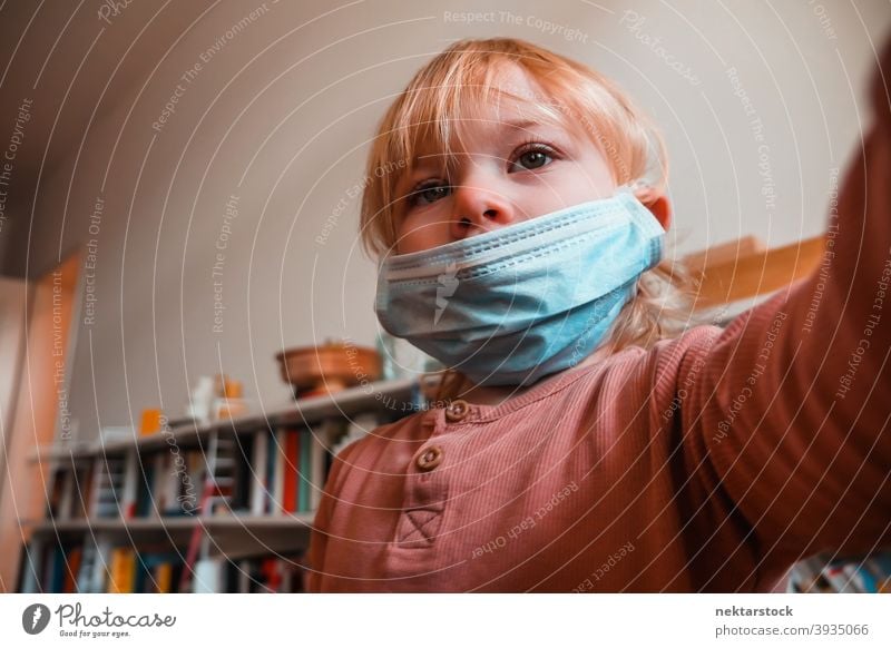 Two Year Old Girl with Face Mask Indoors mask child kid female girl home at home caucasian face mask protective 2020 lockdown quarantine real life real people