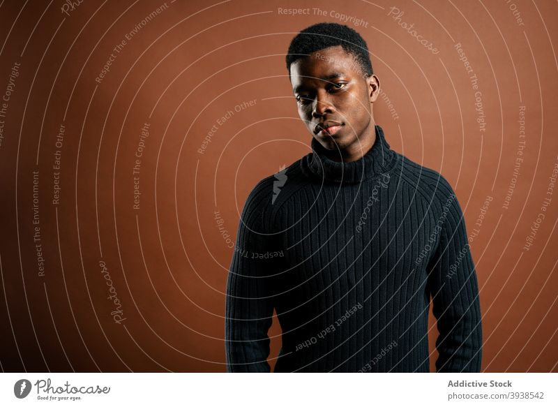 Thoughtful black man in casual outfit in studio thoughtful pensive serious think contemplate style male ethnic african american ponder young focus wistful