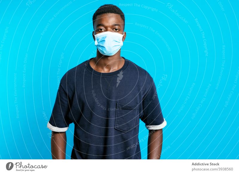 Black man with medical mask coronavirus put on new normal prevent protect sterile covid 19 male black ethnic african american epidemic infection studio covid19