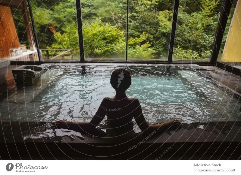 Silhouette of young caucasian woman in Japanese onsen 30s attractive tourist tourism gues