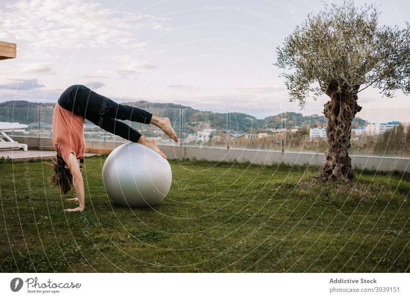 Yogi Man Practicing Yoga on Fitness Ball in Lotus Pose Stock Image