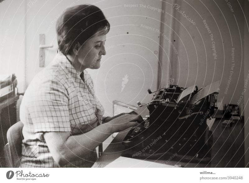 The typist - woman writing with old typewriter, analog photo Typewriter Woman Office secretary nostalgically Write Typing Keyboard Workplace Work and employment