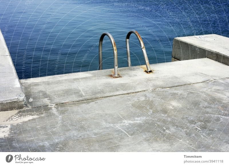 Entry into the North Sea Water Concrete Pool ladder Metal Denmark Colour photo Deserted Swimming pool Vacation & Travel
