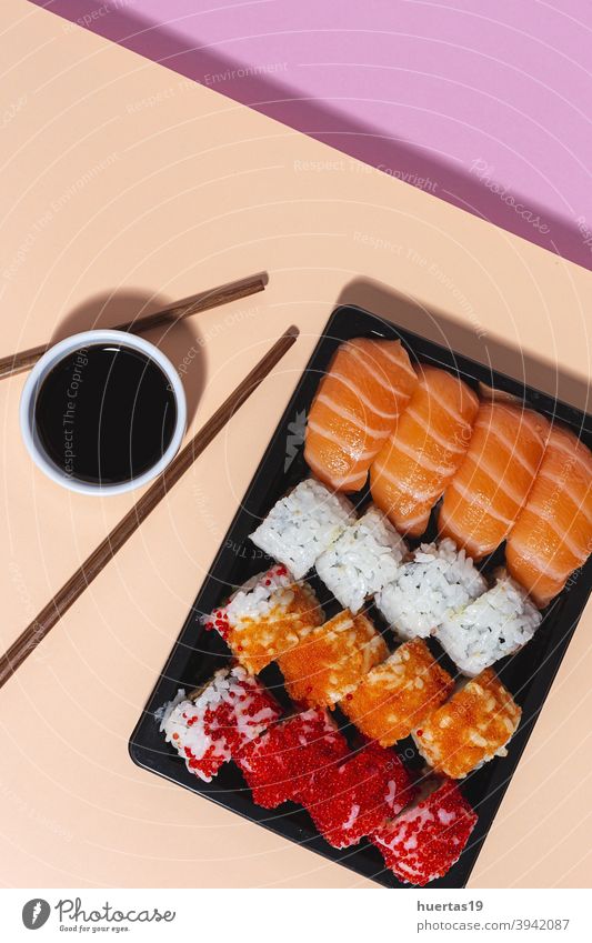 Japanese takeaway food concept. Sushi assortment to go Food Salmon Meal Fish Lunch Rice Box Asian Food Healthy Roll background Seafood Plastic Wasabi Fresh
