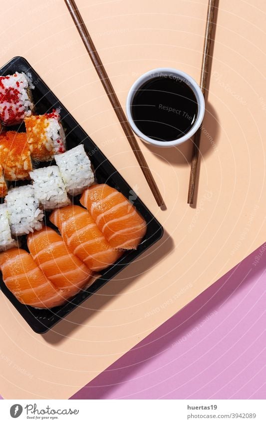Japanese food concept to go. Sushi take away assortment japanese sushi salmon meal fish lunch rice box asian food healthy roll background seafood plastic wasabi