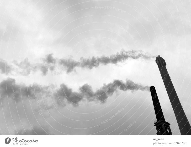Smoking chimneys against a grey sky Chimney Vent Smoke exhaust gases Industry Public utilities Tower Emission CO2 emission Environmental pollution