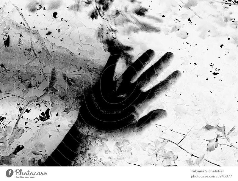 Black hand wipes from left to right with motion blur Hand blurred Creepy Black & white photo Inverted Crime thriller Threat Fear Help Shadow Wipe