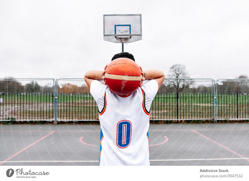 Portrait of a male on a basketball court about to score. Sport concept. winner succeed youth uniform player goal strength support practice challenge success
