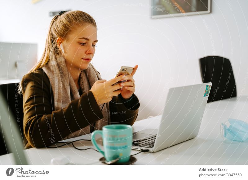Blond Business woman working in an office business computer phone cellphone browsing laptop female professional people businesswoman beautiful person manager