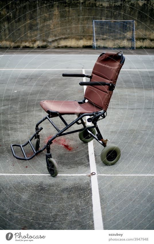 empty wheel chair in tennis court sport wheelchair disability disabled handicap horizontal mobility health medical care transportation equipment object