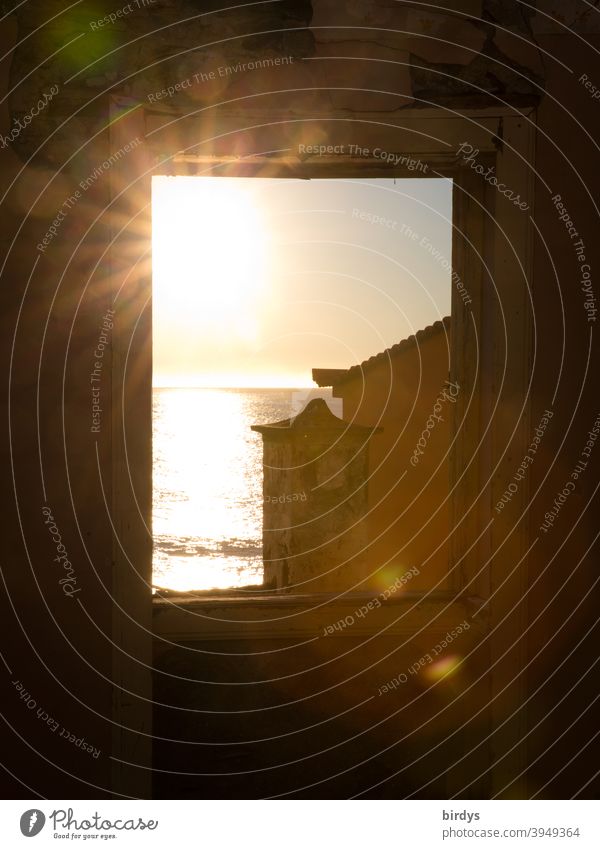 Sun over the sea shines through a window. Sunbeams Window Ocean Vantage point Horizon Light Mediterranean House (Residential Structure) Warmth house by the sea