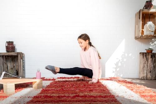 Girl who practices yoga at home. Concept of health. fit workout exercise gym kid daughter pilates child sport woman smile girl happy power little training