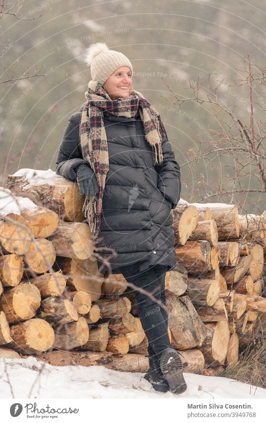 Young woman in the field on firewood in winter with snow adult asia asian background beautiful caucasian fall india indian landscape male nature old outdoor