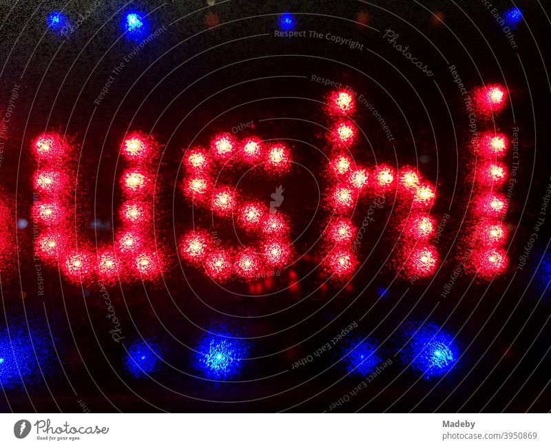 Red neon sign in red and blue for sushi in front of asian snack bar at night Sushi Snack bar Restaurant Neon light Letters (alphabet) Night darkness Blue Black
