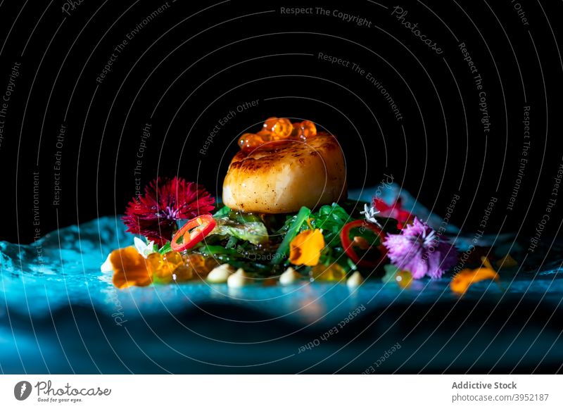 Delectable dish with scallop and noodles garnished with caviar haute cuisine seafood delicious portion gourmet palatable gastronomy meal serve plate tasty