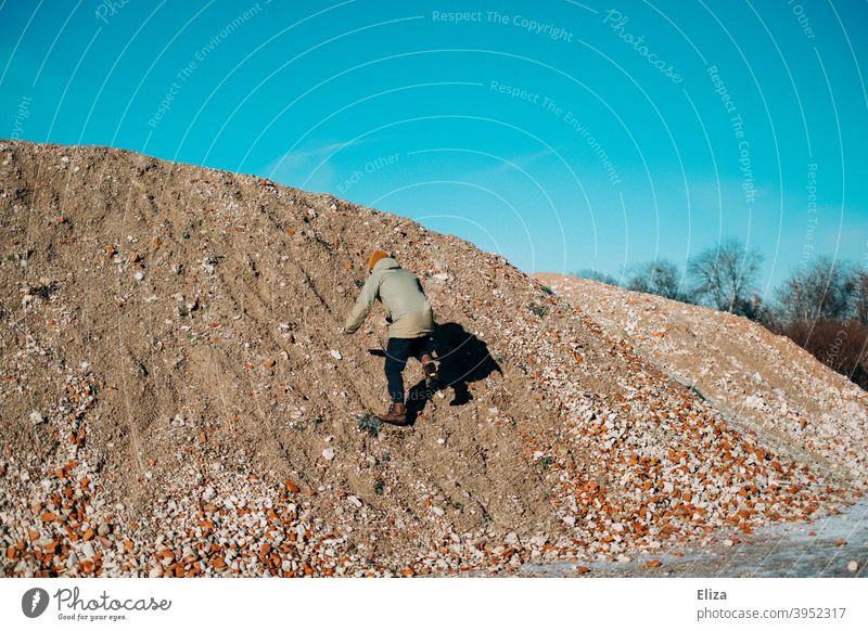 Now hurry... | Climb the hill! Hill Climbing Gravel Man climb mountain Tall Human being slippery Blue sky