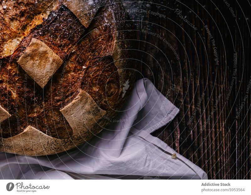 Freshly baked bread on table crust bakery fresh food tradition bakehouse loaf kitchen culinary rustic wooden napkin gourmet pastry gastronomy healthy natural