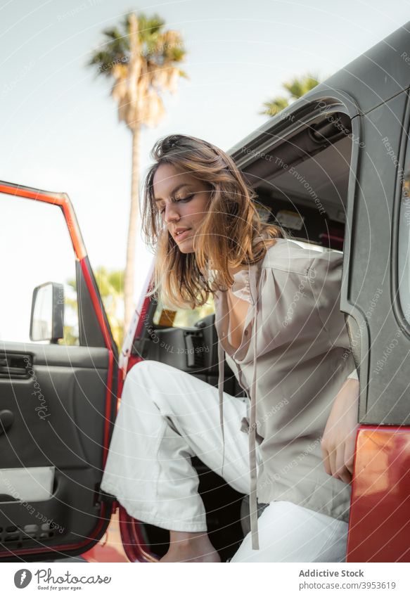 Calm woman in stylish wear sitting in car driver style luxury trendy calm determine outfit vehicle female relax auto modern summer automobile rest young