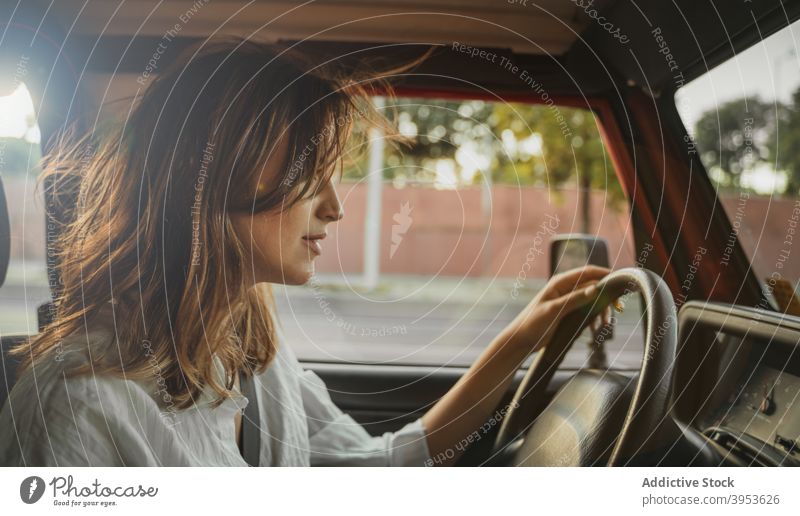 Woman driver sitting in automobile woman car charming calm female seat transport young vehicle relax style rest summer contemporary confident appearance cool