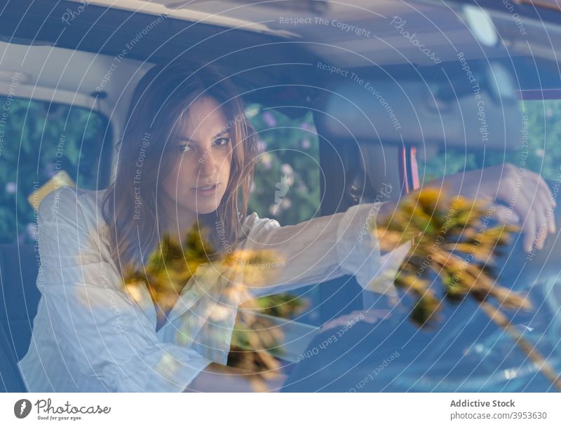 Woman driver sitting in automobile woman car charming calm female seat transport windshield young vehicle relax style rest summer contemporary confident