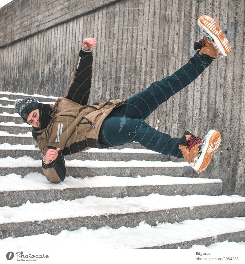 Man slip on ice and falling down stairs Slippery surface Slip and fall Slip on ice Falling down stairs Stairs Winter Ice Snow Risky Injury Dangerous Accident