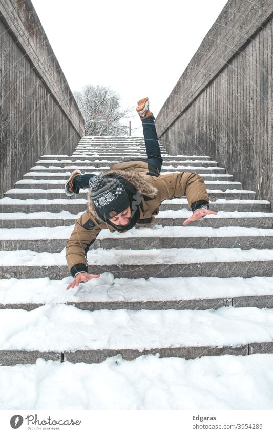 Man slip on ice and falling down stairs - a Royalty Free Stock Photo from  Photocase