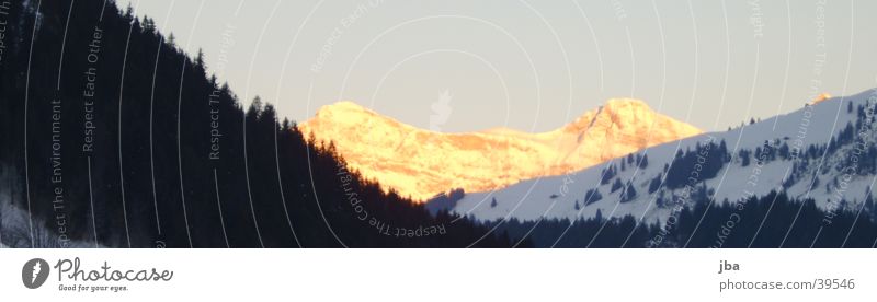 Sunrise over Saanen Gstaad Dark Mountain Bright Snow Sonnenberg
