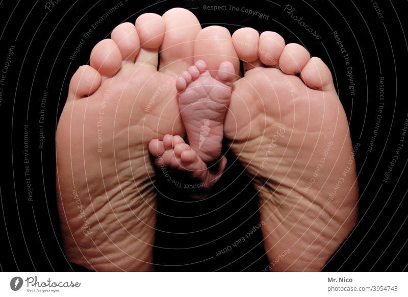 small and big feet Baby Man Small Diminutive Family & Relations Child Father Son Barefoot Feet Lie Toes Sole of the foot Well-being Harmonious Happy Warmth