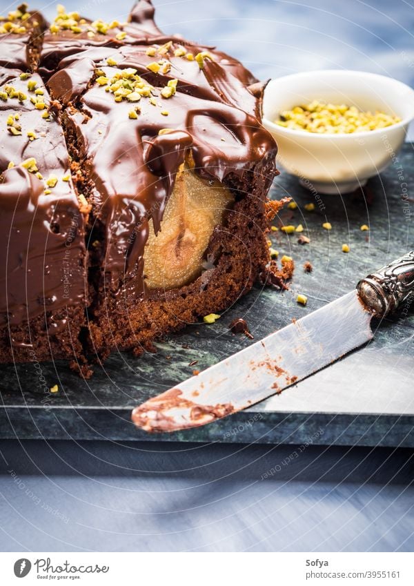 Dark Chocolate cake with pears and pistachio chocolate dessert food frosting sweet delicious gourmet pastry tasty meal homemade baked bakery nut fresh fruit