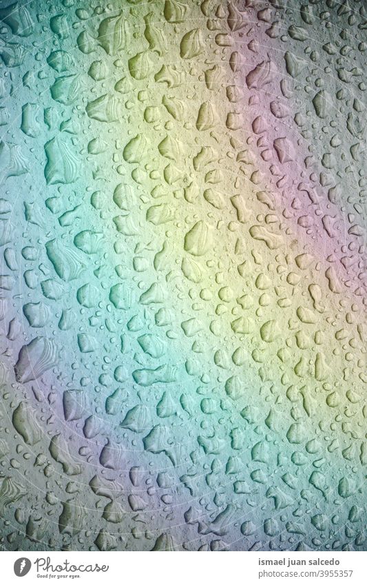 raindrops and rainbow on the metallic surface rainy water wet floor aqua ground abstract background pattern textured colors backgrounds Rainbow Drops of water