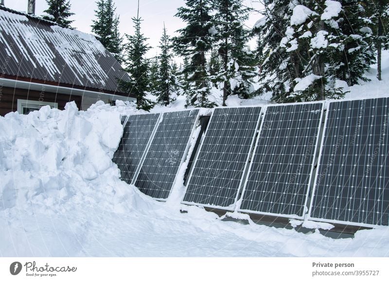 Solar battery - an alternative energy source. View of solar panels covered with snow after a snowfall. Control Panel Snow Winter solar energy solar power plant