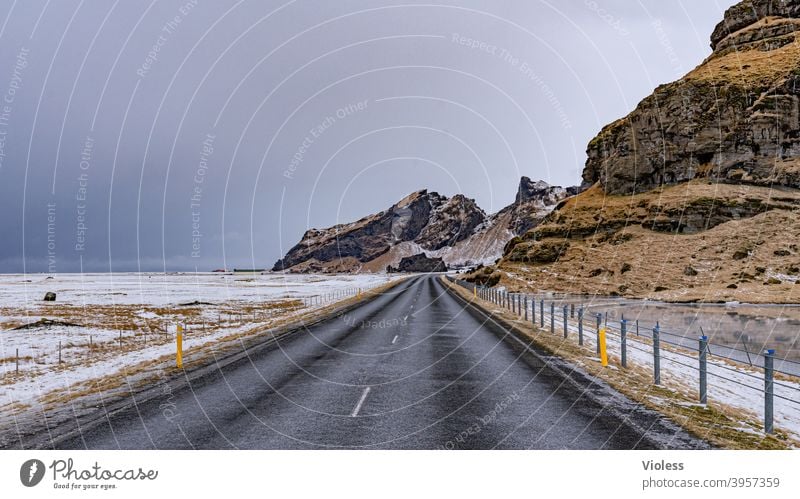 Always follow your nose - road in the north Belt highway Frozen Direct Street Nature infinitely Clouds Snow mountains Mountain Deserted Blue Frost Iceland