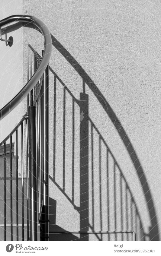 Stair railing with shadow cast on a wall Banister Light Shadow Wall (building) flexed Direct Deserted Exterior shot Building Black White Gray Contrast lines