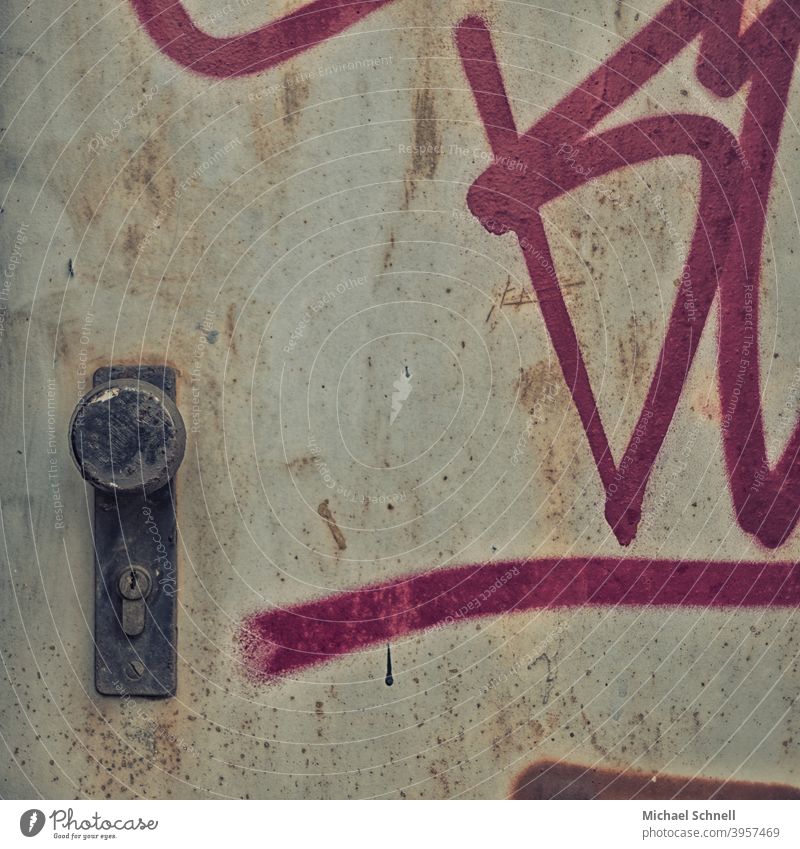 Old metal door with graffiti Graffiti Gloomy dreariness Shabby Gray Building