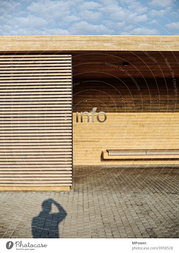 to the info Information Exchange of information Shadow Bus stop bus stops Bus shelter Bench straight lines Wood Exterior shot Communicate Characters Deserted