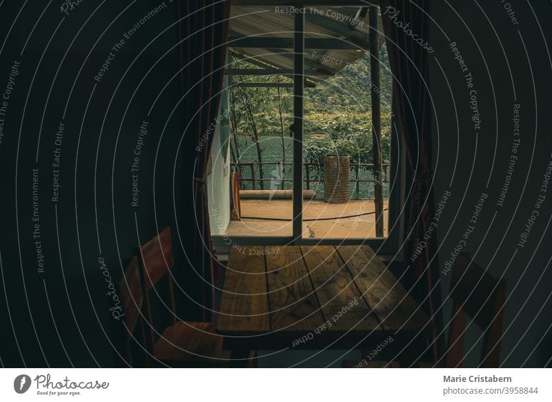 Window in the dark cabin showing concept of depression, loneliness, mental health and isolation during covid-19 quarantine covid-19 pandemic new normal