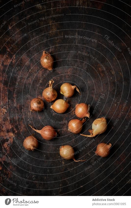 Onions on dark rustic wooden background onion food vegan composition cooking collection delicious group healthy ingredient organic natural raw vegetable