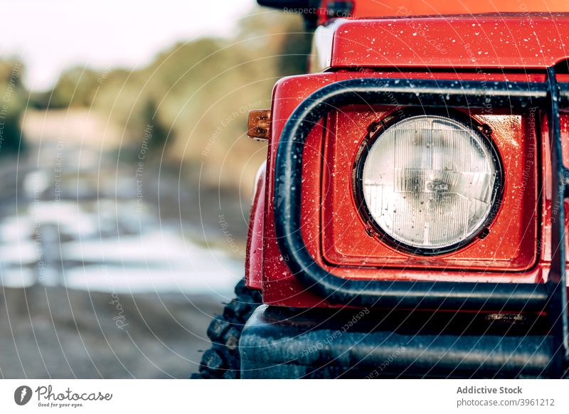 Headlight of off road car driving in nature headlight suv drive vehicle adventure travel red journey lifestyle power trip extreme road trip energy part fragment