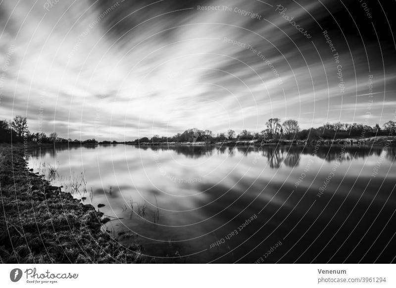 Long exposure with view over the Elbe Elbe Landscape black on white River Water Lutherstadt Wittenberg Views of the river river landscape Clouds Heaven