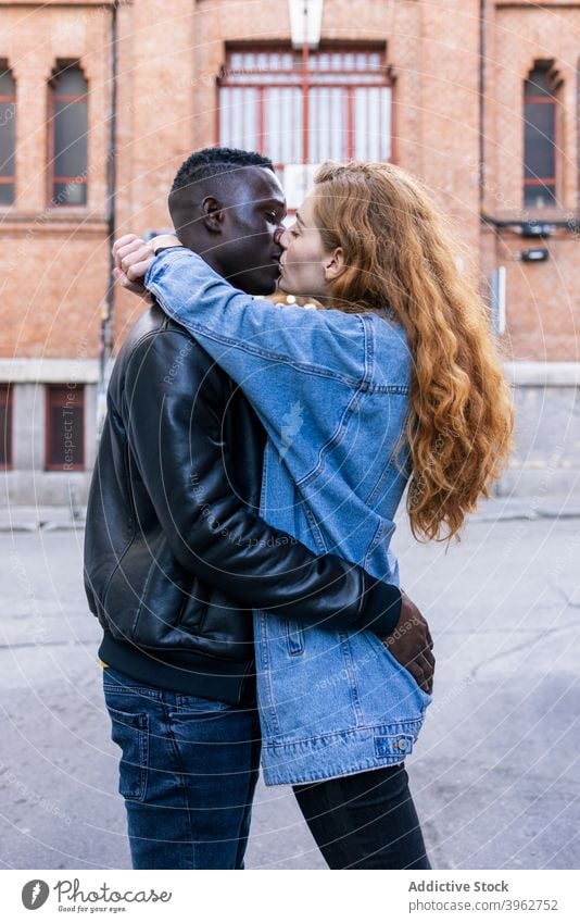 Multiracial couple cuddling on street cuddle together tender city style trendy delicate love relationship multiethnic multiracial diverse black african american