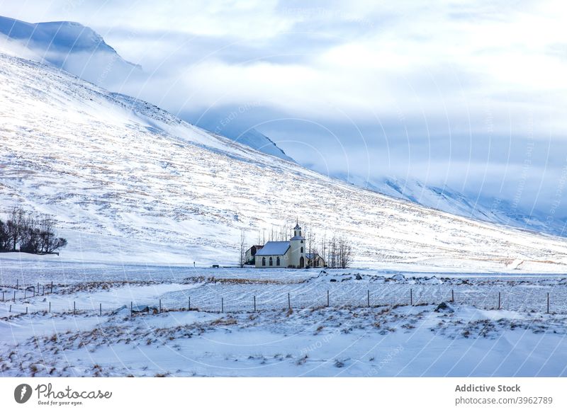 Church in mountains in winter church highland landscape building lonely snow valley scenery iceland scenic sunny frost range nature season rock cold weather
