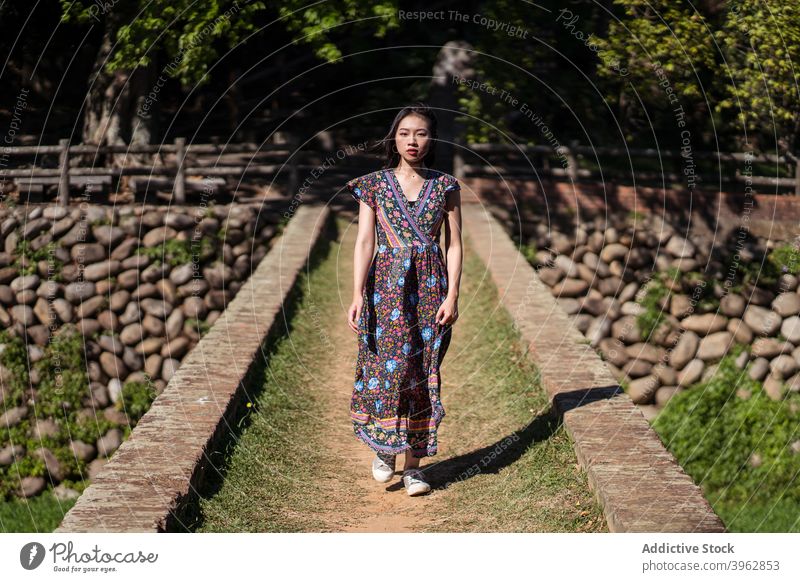 Woman standing on bridge in forest woman summer vacation carefree relax brick aged heritage female daping red bridge taiwan travel trip tourist enjoy style