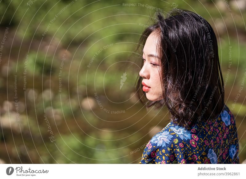 Asian woman in nature in summer calm tranquil sunny relax natural appearance beauty female asian ethnic taiwan peaceful daytime young rest enjoy harmony serene
