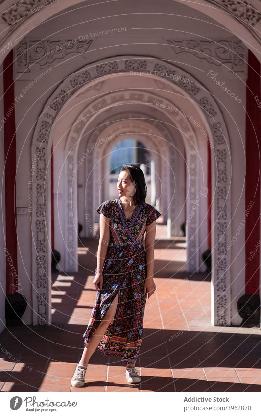 Ethnic woman standing in arched passage of bridge tourist archway traveler destination landmark holiday female ethnic asian cikang overpass taiwan architecture