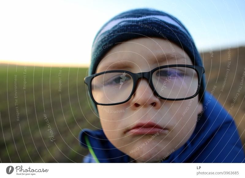 face an upset child wearing glasses childhood empathy challenge need neglect coping with social distancing care soothing Fear of the future Disbelief Anger