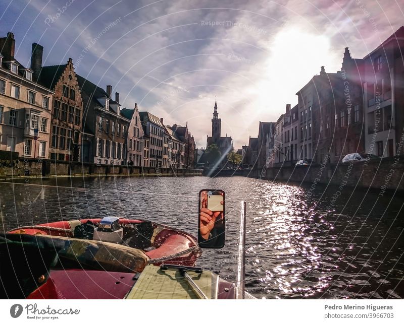 Photo taked in a boat in the Burges canal bruges reflections brugge building belgium view bridge